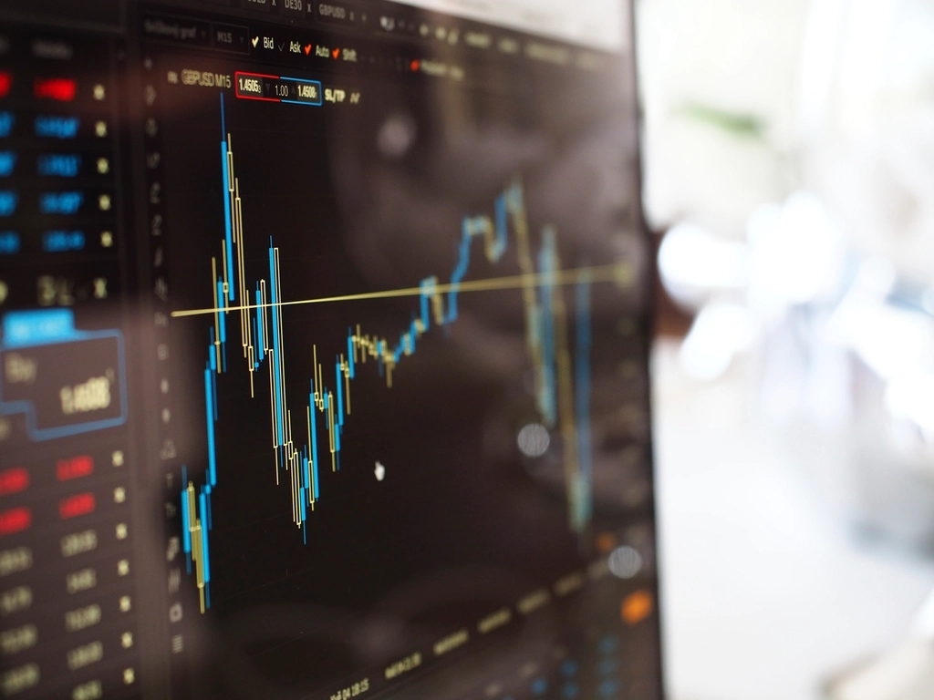 Screen showing stock tickers and price charts